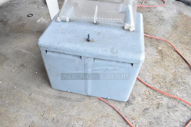 Metal commercial countertop electric meat tenderizer, 115 volts, 1 phase, blue, signs of wear, clear top cover.