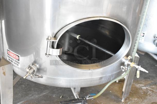 Stainless steel commercial beer tank, model SV-2, 8.75 BBL. Features "Danger" label, open hatch, and attached valves.
