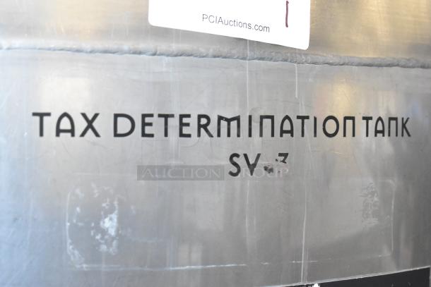 Stainless steel commercial floor-style tax determination tank, model SV-2, with visible "TAX DETERMINATION TANK" label.