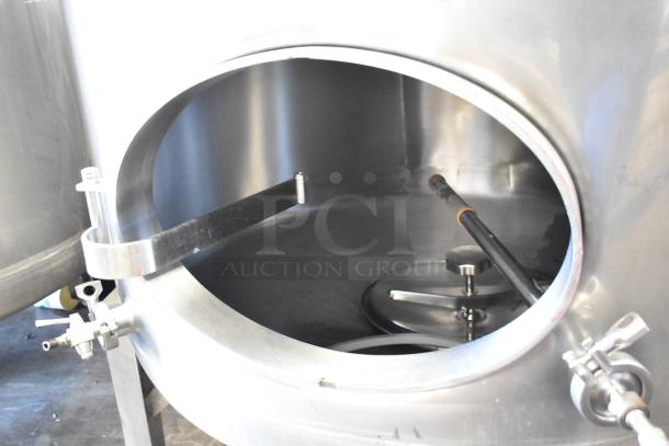 Stainless steel 8.75 BBL beer tank, floor style, with open hatch and visible interior components. Used for beer tax determination.