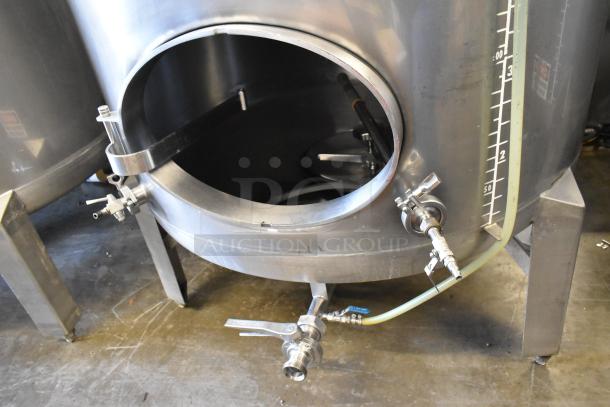 Stainless steel 8.75 BBL / 367-gallon commercial beer tank with measurement markings and valves. Floor-mounted, clean condition.