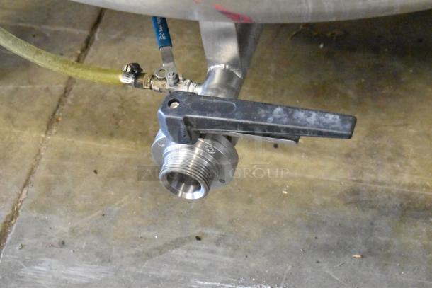 Stainless steel beer tax determination tank valve close-up, showing nozzle and lever, used condition.