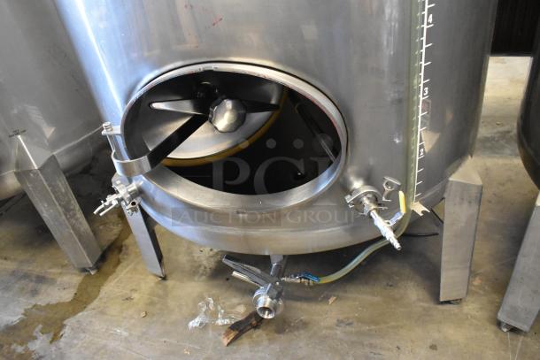 Stainless steel commercial 8.75 BBL clear beer tank with valves and gauge, in good condition.