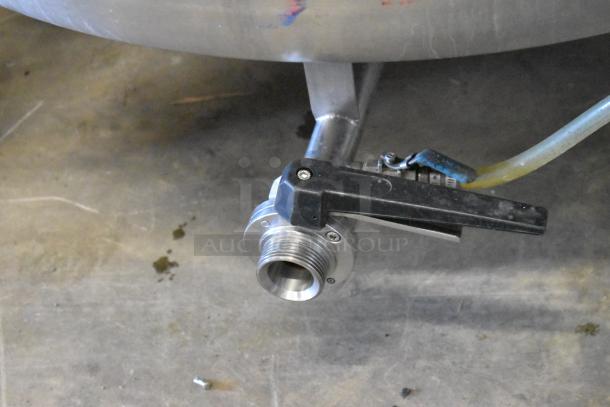 Stainless steel outlet valve of 8.75 BBL commercial beer tank, showing connection detail and condition.