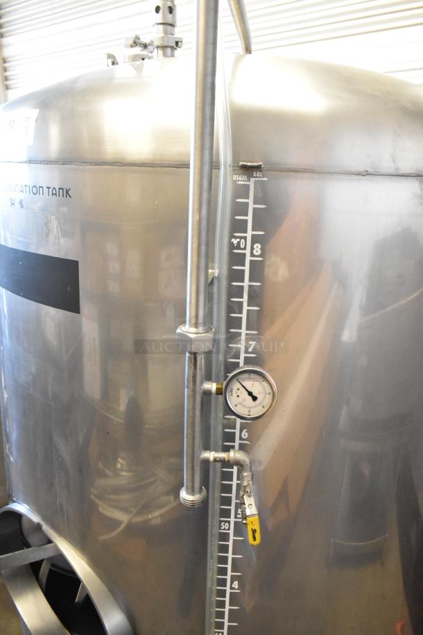 Stainless steel 8.75 BBL beer tax determination tank, features gauge and level markings, excellent condition.
