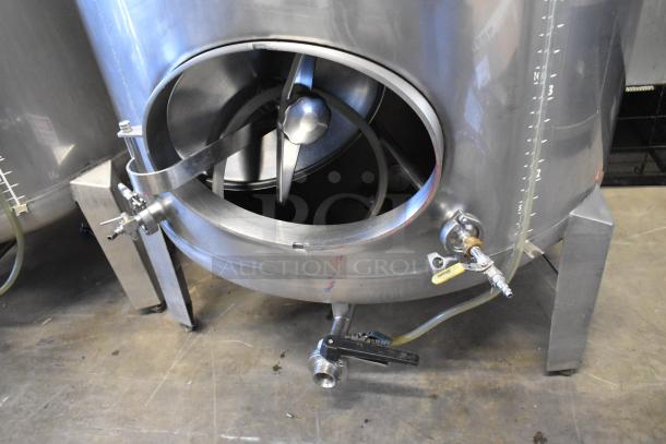 Stainless steel 8.75 BBL/367-gallon beer tank, with large access hatch, outlet valves, and volume markings, in good condition.