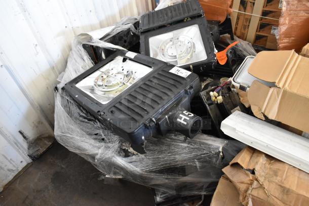 15 various light fixtures, some unboxed, in mixed condition. Includes labels and wiring. Bid offers 15 times value.