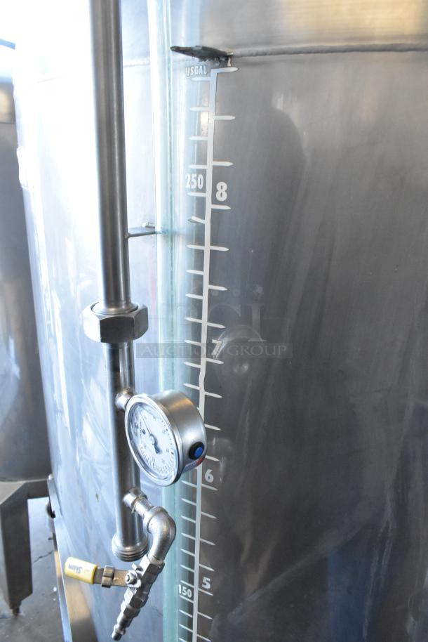 Stainless steel 8.75 BBL / 367 gallon beer tax determination tank with gauge, sight glass, and volume markings. Commercial condition.
