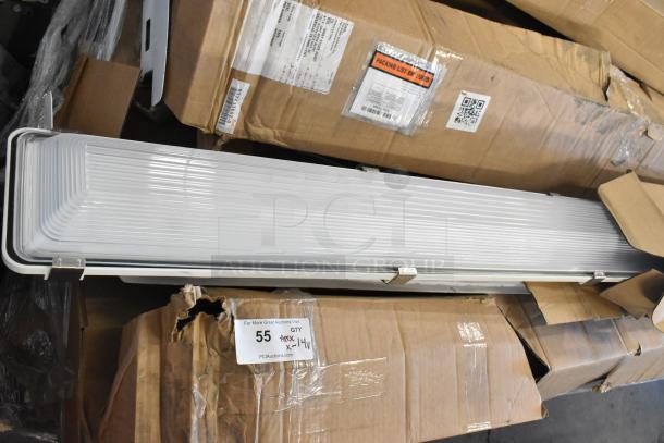 14 brand new scratch and dent items, including light fixtures and fluorescent tube light frames, packaged in boxes.