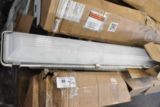 14 brand new scratch and dent items, including light fixtures and fluorescent tube light frames, packaged in boxes.