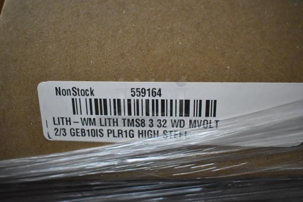 Cardboard box with label: NonStock 559164. Contains 14 scratch and dent items, including light fixtures and fluorescent tube frames.