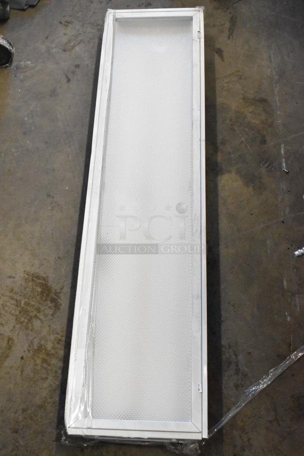 Rectangular light fixture with textured cover, likely part of 7-set including Lithonia Lighting GTL 4 40L; unused condition.