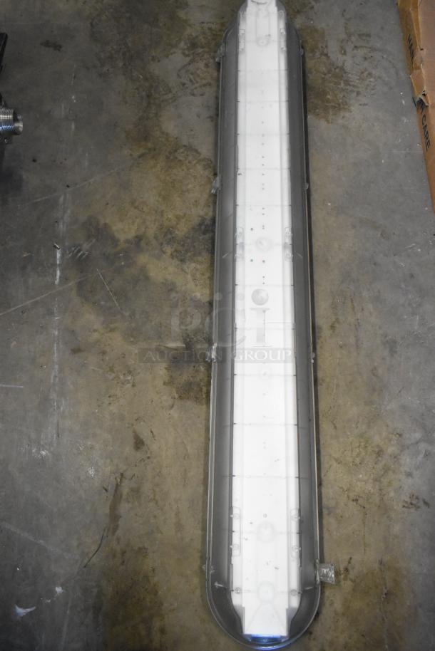 7 light fixtures including Lithonia Lighting GTL 4 40L GZ10 LP840, new condition, industrial use.