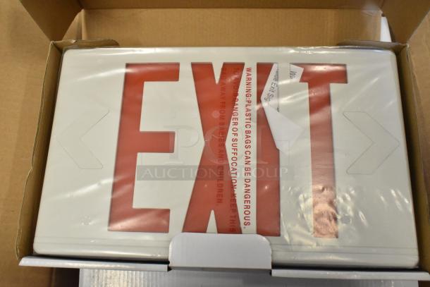 Box of 6 brand new exit signs, visible scratch and dent. White plastic with red lettering.