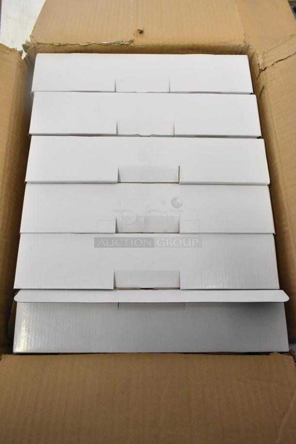 Box of 6 brand new exit signs, scratch and dent condition, unopened in white packaging.