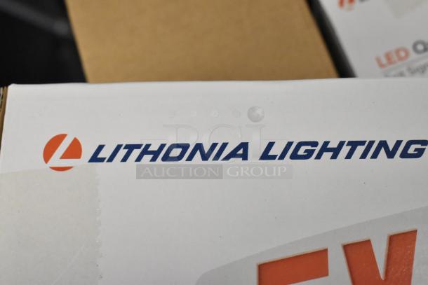 Box of 6 Lithonia Lighting exit signs, brand new with scratch and dent imperfections. Logo visible on packaging.