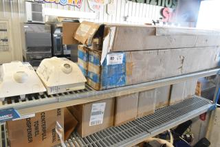 5 new scratch and dent boxes including Dual Lite Emergency Light; visible damage on packaging.