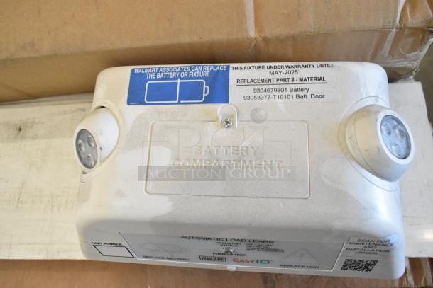 Dual Lite Emergency Light, new condition, visible scratch and dent, warranty valid until May 2025, replaceable battery.