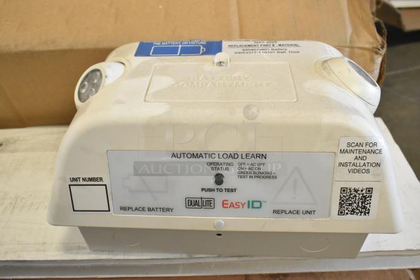 Dual Lite EasyID emergency light, new scratch and dent, automatic load learn feature, QR code for videos, battery compartment.