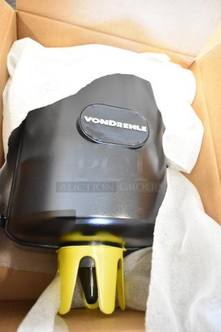 7 new Vondrehle center pull towel dispensers, minor scratches, durable black plastic, logo visible, in box.