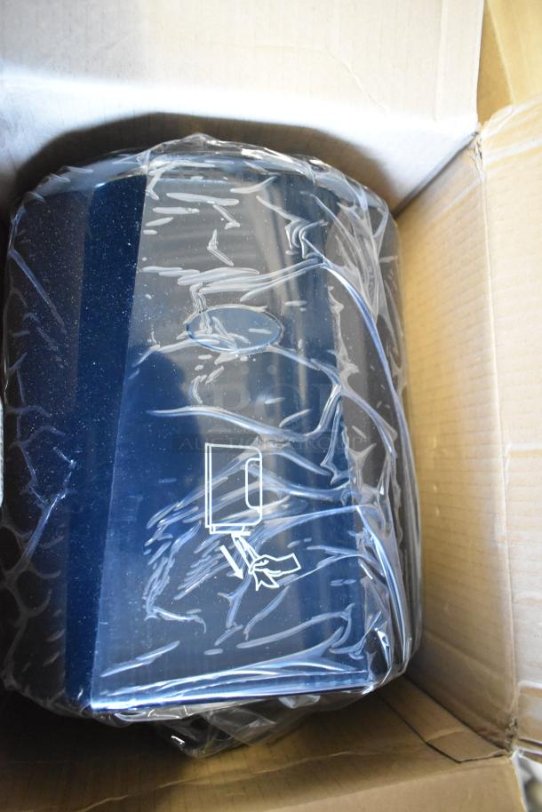 Brand new center pull towel dispenser in packaging, slight scratch and dent condition, boxed for auction, seven available.