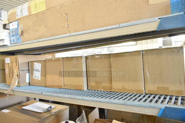 New Center Pull Towel Dispenser boxes with shipping labels, slight box wear, displayed on metal shelving. Auction item.