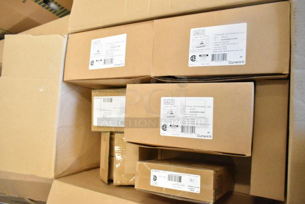 Boxes of 7 new Dual Lite items, including Double Remote Head and EVHCEZP LED Emergency Light Back Box, slightly damaged packaging.