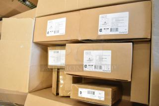 Boxes of 7 new Dual Lite items, including Double Remote Head and EVHCEZP LED Emergency Light Back Box, slightly damaged packaging.