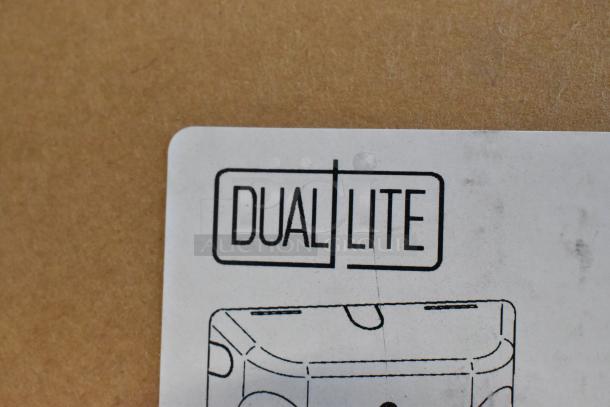 Dual Lite label on the box for scratch and dent items, including EVHCEZP LED Emergency Light. Brand new condition.