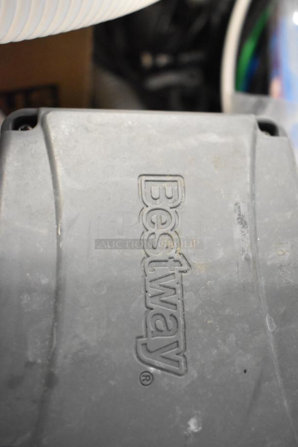Bestway equipment part with visible logo, likely a filter pump component. Gray color, surface shows minor wear.