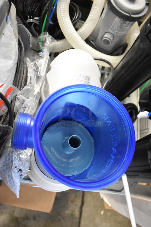 8 various items including an LED troffer and filter pumps, shown in new to gently used condition with visible hoses and components.