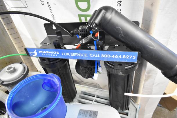 Multi-item lot featuring a Pharmate Systems filter pump, blue container, and hardware. Includes service contact info.
