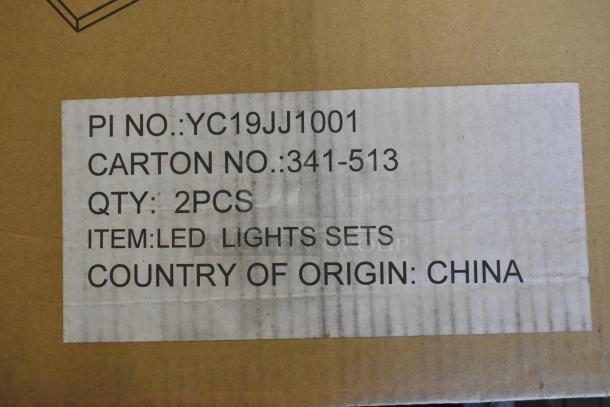 4 brand new 2x2 LED troffers in original packaging, labeled "LED Lights Sets," carton of 2 pieces, made in China.