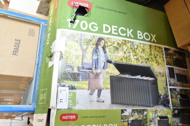 Brand new Keter 170G deck box in original packaging, visible scratch and dent on box. Ideal for outdoor storage.
