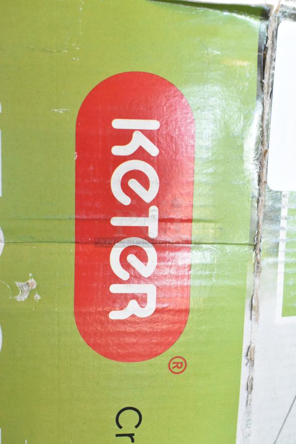 Brand new Keter 170G deck box with minor scratches and dents visible on packaging. Green box with red Keter logo.