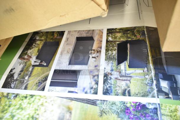 BRAND NEW Keter 170G Deck Box with minor scratches and dents. Image shows outdoor use, sturdy construction.