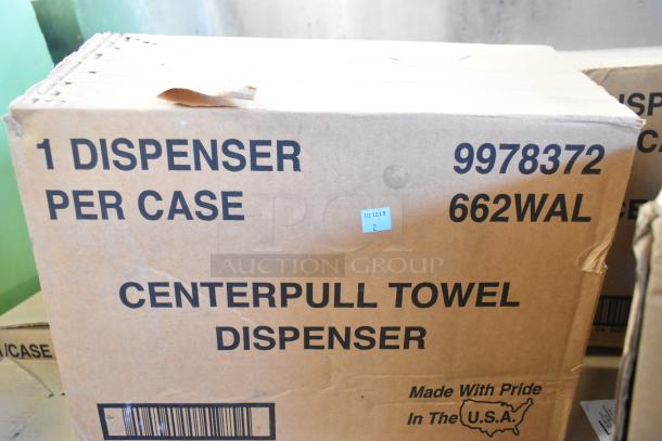Box of 23 brand new, scratch and dent center pull towel dispensers, item 9978372, made in the USA.