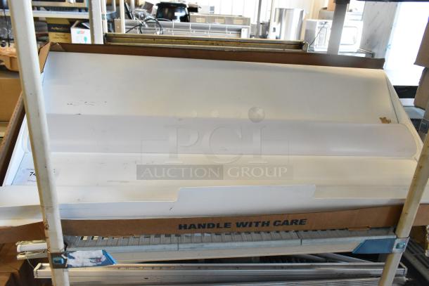 Lithonia Lighting 2BLT4 40L ADSM GZ10 LP840 UA Troffer, new condition, in box labeled "Handle with Care."