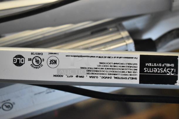 Alt text: Close-up of a fluorescent tube light with visible labels including DLG, UL Classified, and NSF markings.
