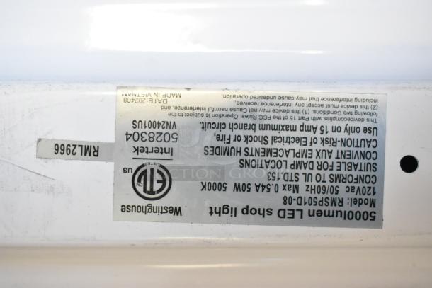 Westinghouse LED shop light label showing model RPSP10-08, suitable for damp locations, max 50W, made in Vietnam.
