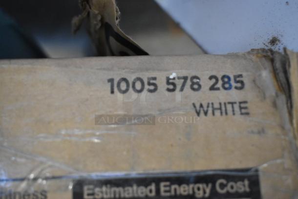 Cardboard box with code "1005 578 285" and "WHITE" text, part of auction for 7 various light fixtures.