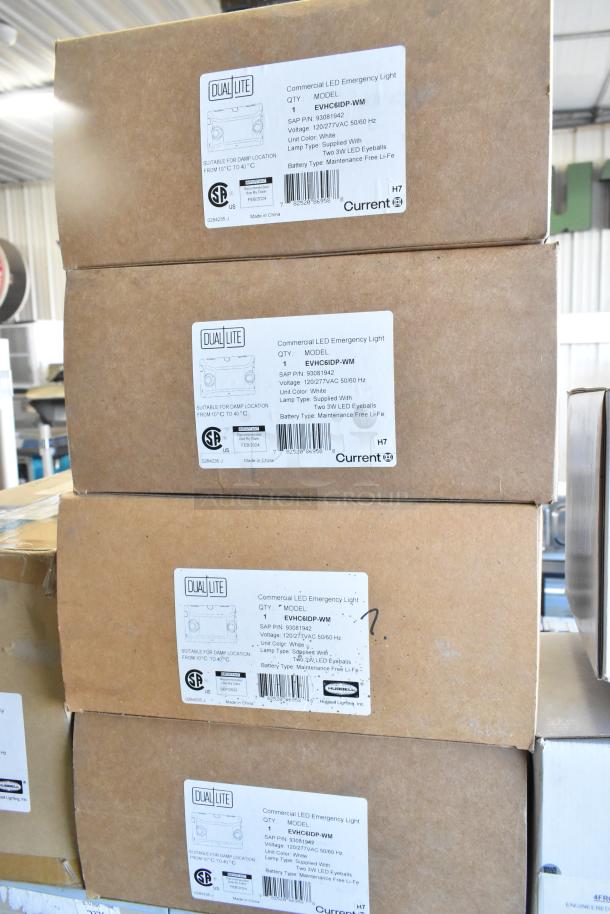 Boxes of Dual Lite LED Emergency Lights, model EVHC6IDP-WM, with product labels detailing specs and certifications.
