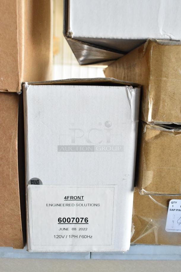 Cardboard boxes stacked, featuring Dual Lite LED Emergency Lights. Visible label reads "4Front Engineered Solutions, 6007076".