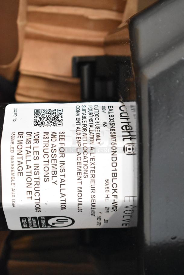 LED flood light with label showing model EALS03, 480V, for outdoor use, and UL certification; excellent condition.