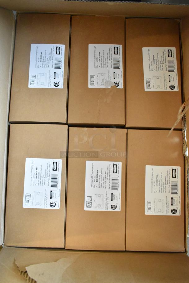 Box of 6 Dual Lite LED Emergency Lights, brand new, scratch and dent. Labels show model and specs.