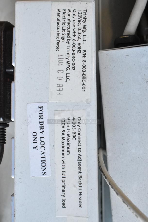 Eight Trinity Mfg. LLC light fixtures, model 8-003-BRC-001, labeled for dry locations, 120V AC, 0.33A, manufactured on Feb 03.