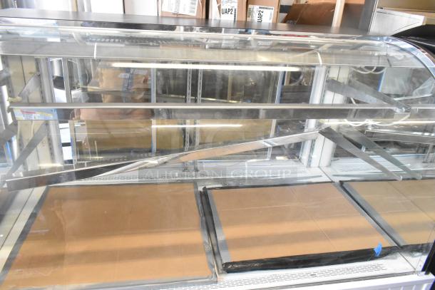 Alternative Air Metal Commercial Display Case by Cooking Performance Group, showcasing dual shelves and glass front. Appears in good condition.