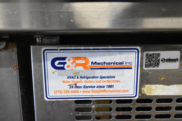 Delfield stainless steel commercial pizza prep table, 115 volts, 1 phase, sturdy condition. Label shows G&R Mechanical Inc.