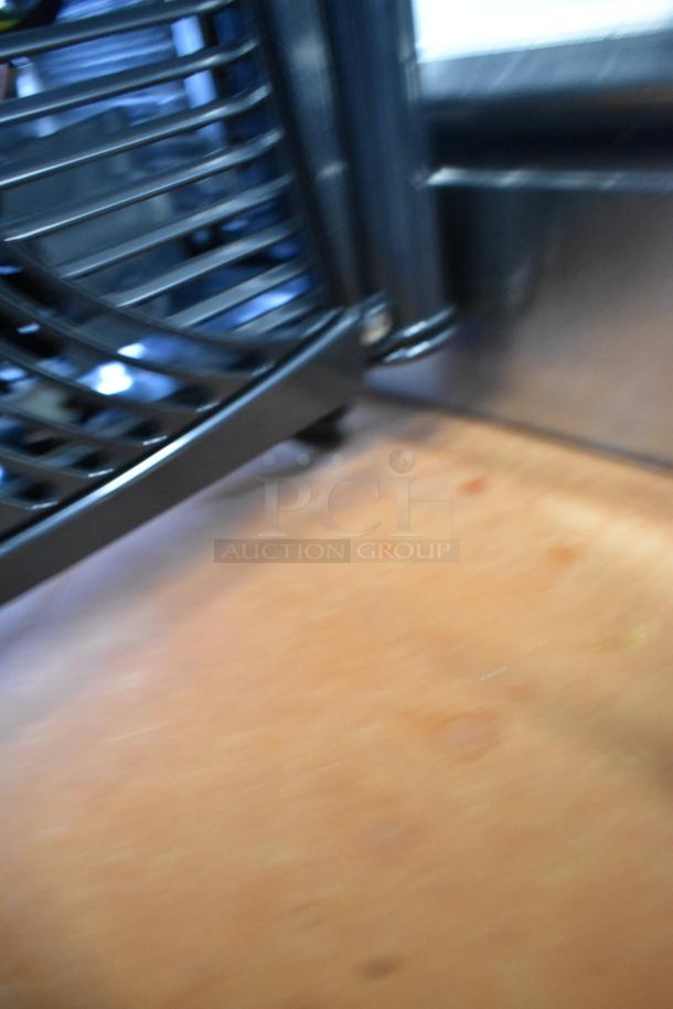 A blurred image showing part of the Carnival King COLDREAM 1M refrigerated beverage dispenser.