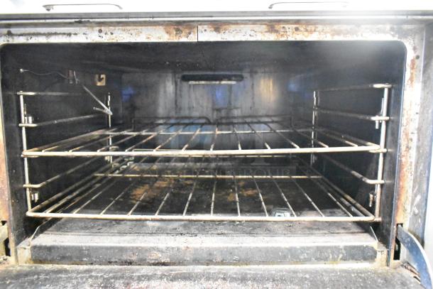 Southbend P36G-BBB 6 burner range oven interior, stainless steel, natural gas, commercial use, shows wear and signs of use.